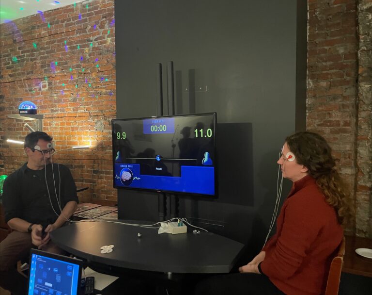 Sara Hall and Doug Smullens playing Brain Ball at Moberg Analytics