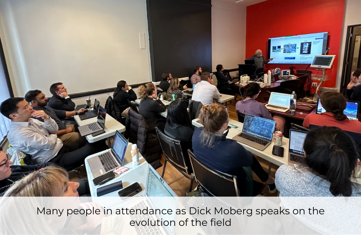 Many people in attendance as Dick Moberg speaks on the evolution of the field