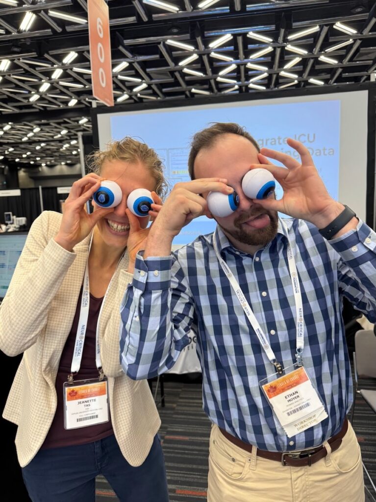 Dr. Jeanette Tas (Kepler University Hospital) and Ethan Moyer eyeing up the coffee bar.